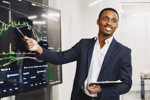 Businessman presents financial data using graphs, showcasing technology and analysis in a corporate environment.
